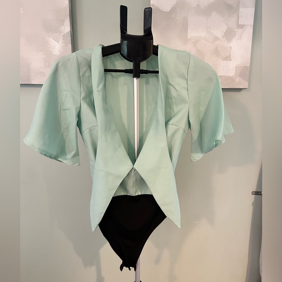 LIGHT BLUE DEEP V BODY SUIT WITH TIE FRONT DETAIL AND RUFFLED SHORT SLEEVES - Picture 1 of 2